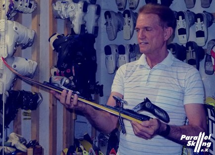 Ken Lawler showing first day short ski equipment room